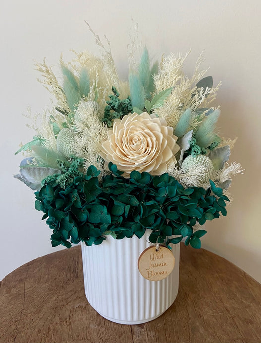 Peacock is created using dried, preserved and faux flowers and displayed in a ribbed ceramic pot. It's bold tones of teal and white will add a statement to any room in the home or office and is also the perfect size for Nursing Homes and Hospitals. Approx size is 30cm x 20cm including pot. Sutherland Shire delivery. Sydney wide delivery. Australia wide delivery