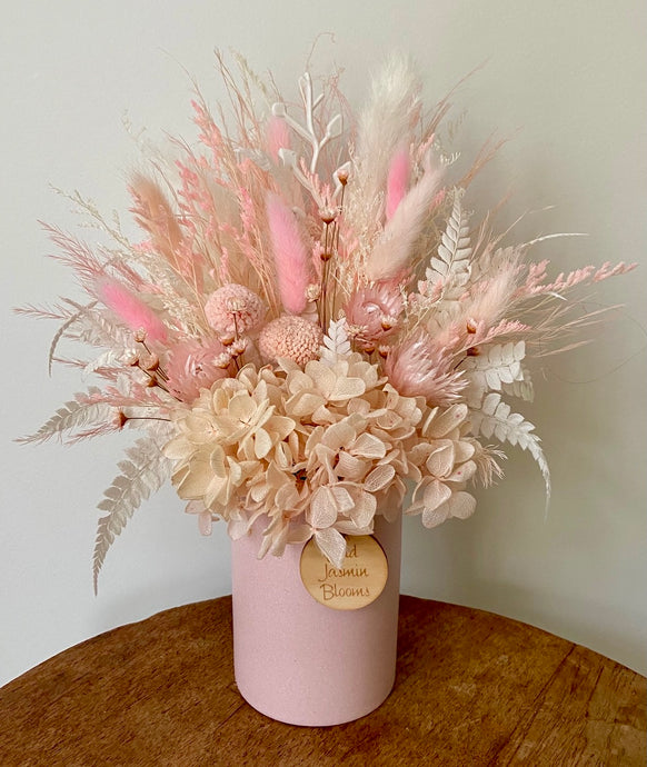 Rose-Hip is created using dried, preserved and faux flowers and displayed in a ceramic pot. It's pretty tones will soften any room, home or office. Approx size is 28cm x 20cm including pot. Sutherland Shire delivery. Sydney wide delivery. Australia wide delivery.