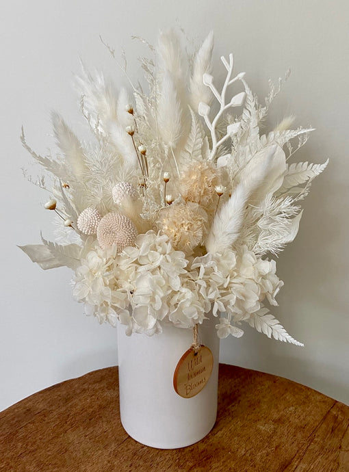 Dandelion is created using dried, preserved and faux flowers and displayed in a ceramic pot. Its natural colours add a calming vive to any room, home or office. Approx size is 28cm x 20cm including pot.Sutherland Shire delivery. Sydney wide delivery. Australia wide delivery.