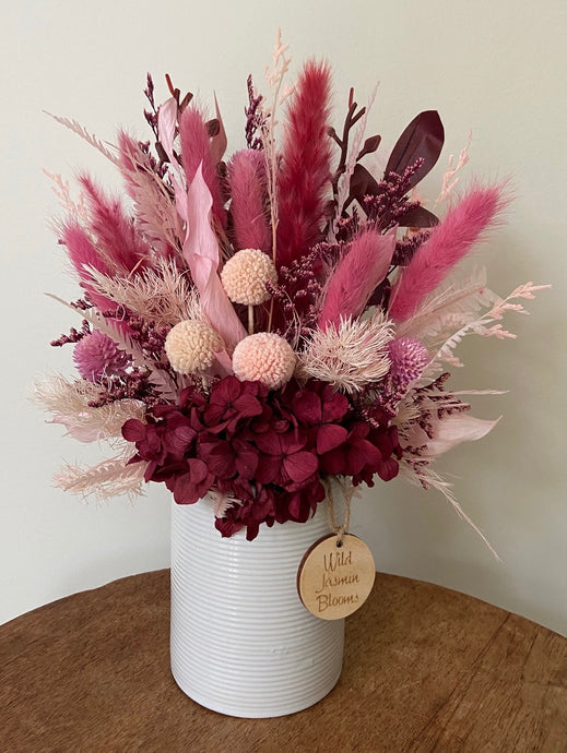 Merlot is created using dried, preserved and faux flowers and displayed in a ceramic pot. Its deep wine colours add a warmth of colour to any room, home or office. Approx size is 28cm x 20cm including pot. Sutherland Shire delivery.Sydney wide delivery. Australia wide delivery.