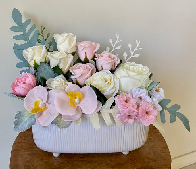 Scented soap Trough arrangement is created with soap and faux flowers and displayed in a ceramic trough. Makes a sweet gift or even a nice addition to a powder room. Approx size is 25cm x 30cm. Soap flowers Sutherland Shire. Soap flowers Sydney. Flower bouquets made from soap.