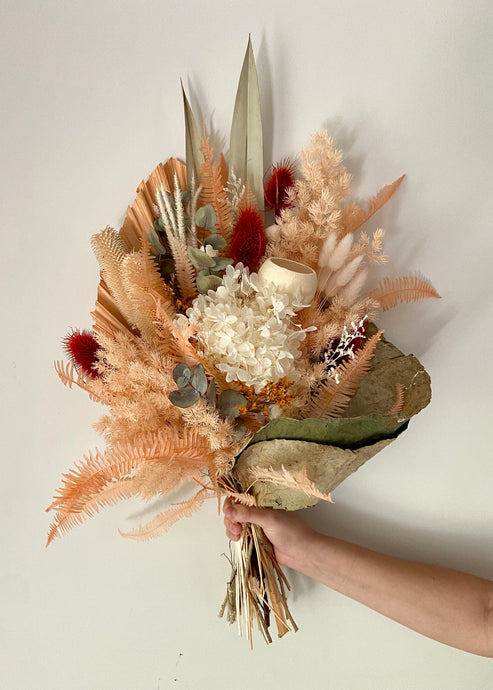 Orange Bliss Lotus Wrap is created using dried, preserved and faux flowers. This bouquet comes gift wrapped with a ribbon and can be displayed laid down or popped into a vase. Approx length is 60cm including stems. Sutherland Shire Delivery. Sydney Delivery. Australia Wide Delivery.