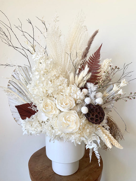 White Mountain is created using dried, preserved and faux flowers and is displayed in a white tapered pot. This is a large arrangement in whites, creams and brown and would look stunning in any home or office. Approx size is 60cm x 45cm including pot. Delivery Sutherland Shire.