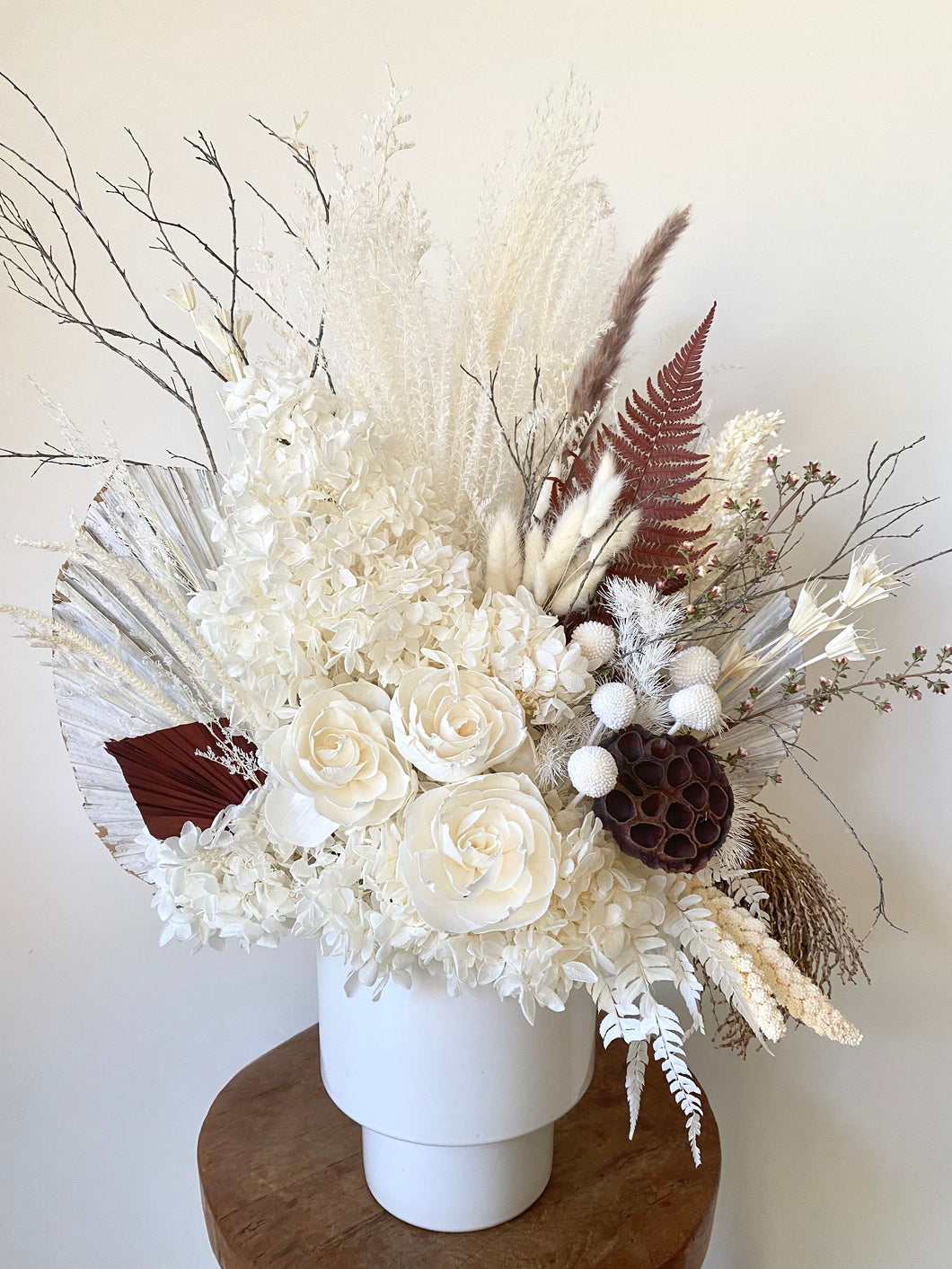 White Mountain is created using dried, preserved and faux flowers and is displayed in a white tapered pot. This is a large arrangement in whites, creams and brown and would look stunning in any home or office. Approx size is 60cm x 45cm including pot. Delivery Sutherland Shire.