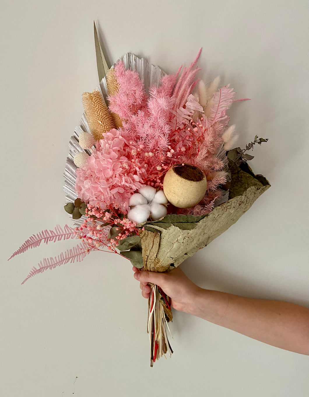Sweet Pink Lotus Wrap is created using dried, preserved and faux flowers. This bouquet comes gift wrapped with a ribbon and can be displayed laid down or popped into a vase. Approx length is 60cm including stems. Sutherland Shire Delivery. Sydney Delivery. Australia wide delivery.