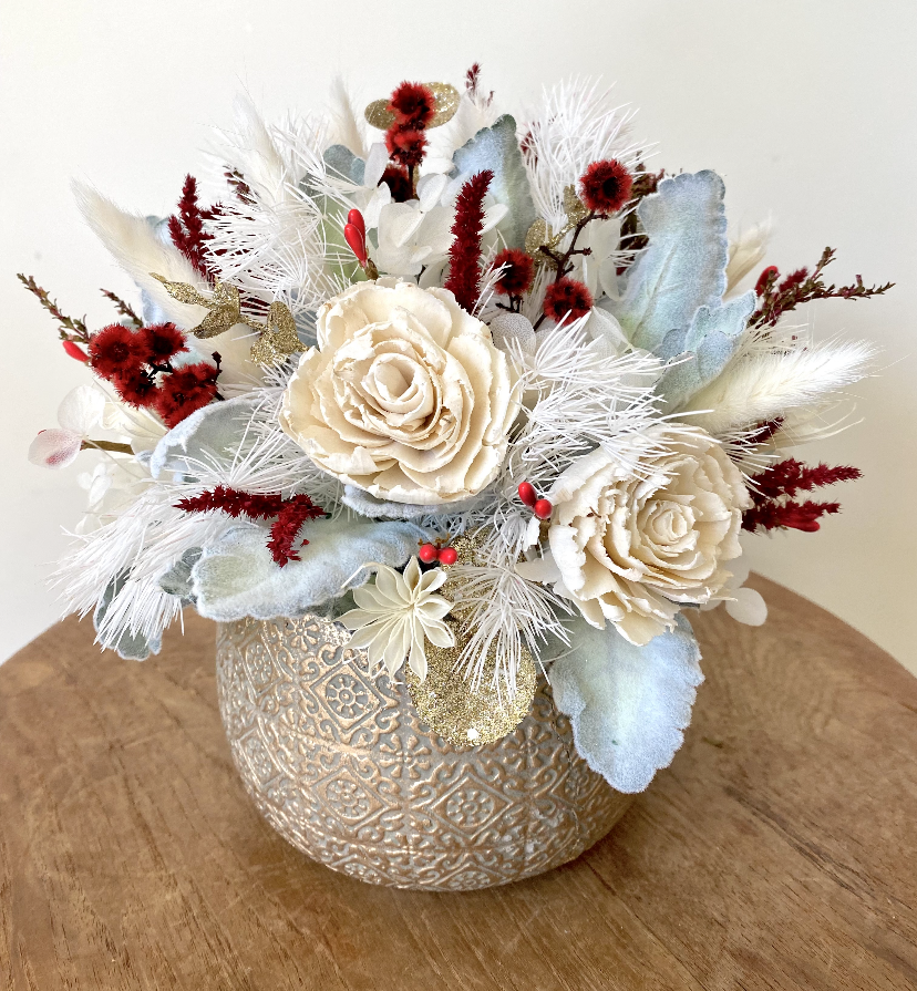 Season Cheer is created with dried, preserved and faux flowers and displayed in a patterned gold pot. This all round compact arrangement would make a lovely table centre for any Christmas table. Message me if you'd like something similar in a different colour scheme. Approx size is 22cm x 22cm including pot. Christmas table centre. Delivery Sutherland Shire. Delivery Sydney. Delivery Australia.