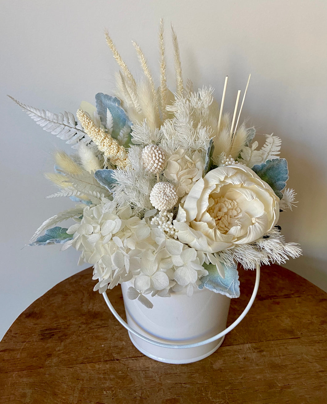 Dried flower arrangement. Dried bucket display. 