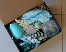 Load image into Gallery viewer, The Unwind Box is perfect for someone who needs to let their hair down. With a bath bomb, satin eye mask, pumice stone, dried posy, blending sponges and a wine tumbler, you will surely be able to unwind! Makes a great Bridesmaid gift pack too! Tumbler or Box can be personalised. Please add Name or small message (couple of words) in Cart. Box size: 23cm x 31cm. Gift boxes delivered Sutherland Shire.  Gift boxes delivered Sydney. Gifts.
