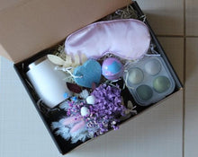 Load image into Gallery viewer, The Unwind Box is perfect for someone who needs to let their hair down. With a bath bomb, satin eye mask, pumice stone, dried posy, blending sponges and a wine tumbler, you will surely be able to unwind! Makes a great Bridesmaid gift pack too! Tumbler or Box can be personalised. Please add Name or small message (couple of words) in Cart. Box size: 23cm x 31cm. Gift boxes delivered Sutherland Shire.  Gift boxes delivered Sydney. Gifts.
