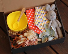 Load image into Gallery viewer, The Feeding Time Baby Box is a gorgeous practical gift for any little one and their mum. Box includes, silicone bowl and spoon, two button up adjustable bibs, crotchet bunny and a dried flower posy. The box can be personalised. Please add Name and DOB in Cart. Box size: 23cm x 31cm. Baby gift boxes delivered Sutherland Shire. Baby Gift boxes delivered Sydney. Baby gifts.
