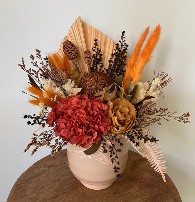 Rustic Charm is a dried, preserved and faux flower arrangement displayed in an apricot ceramic pot. Its rustic colour tone makes a gorgeous side table display for home, office or even hospital or Nursing Home. Approx size is 40cm x 30cm including pot. Sutherland Shire delivery. Sydney wide delivery. Australia wide delivery.