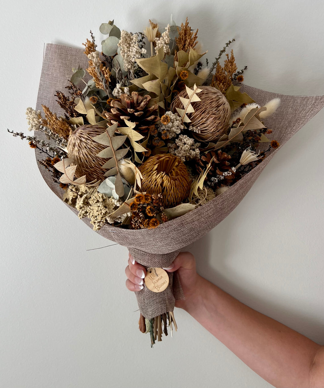 Jasper bouquet is created using dried, preserved and faux flowers. These are great for any occasion and work great in both the home or office. It can be displayed laid along a sideboard, table etc or displayed upright in a vase. Approx length is 45cm including stems. Sutherland Shire delivery. Sydney wide delivery. Australia wide delivery.