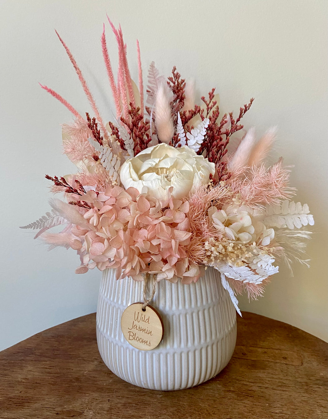 Strawberry Sundae is created using dried, preserved and faux flowers and displayed in a ribbed ceramic pot. It's a very pretty little arrangement for home or office and the perfect size for Nursing Homes and Hospitals. Approx size is 30cm x 25cm including pot. Sutherland Shire Delivery. Sydney wide delivery. Australia wide delivery.