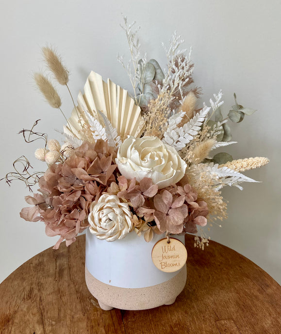 Mocha is created using dried, preserved and faux flowers and displayed in a split tone ceramic pot. It's neutral and mocha tones will add a boho vibe to any room in the home or office or is the perfect size for Nursing Homes and Hospitals. Approx size is 30cm x 25cm including pot. Sutherland Shire delivery. Sydney wide delivery. Australia wide delivery.