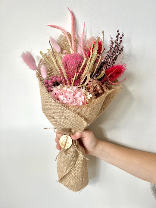 Pink Lemonade Posy is created using dried, preserved and faux flowers. This posy comes gift wrapped and can be displayed laid down or popped into a small vase. Approx length is 40cm including stems. Sutherland Shire Delivery. Sydney Delivery. Australia wide delivery.