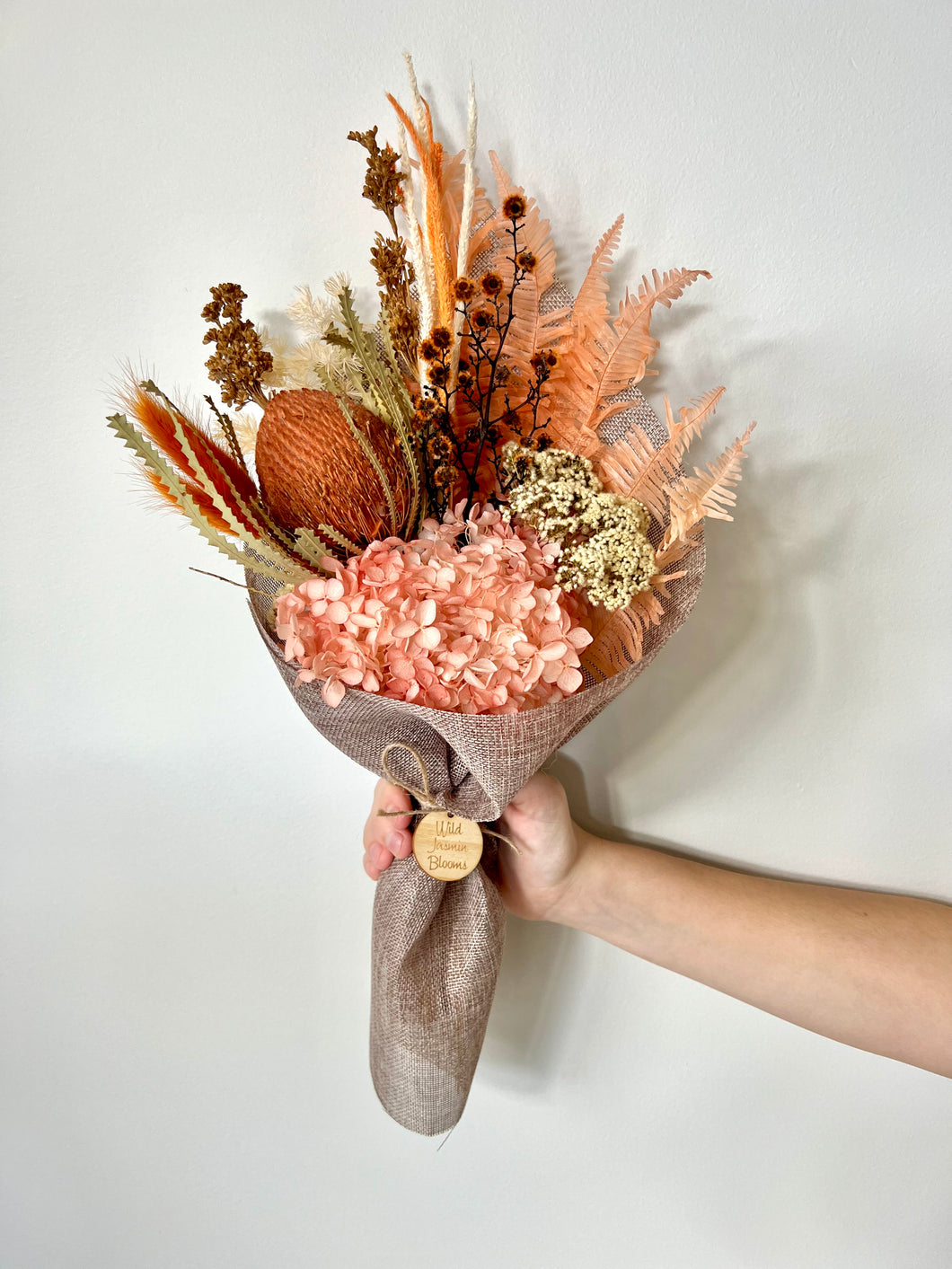 Orange Marmalade Posy is created using dried, preserved and faux flowers. This posy comes gift wrapped and can be displayed laid down or popped into a small vase. Approx length is 40cm including stems. Sutherland Shire delivery. Sydney delivery. Australia wide delivery.